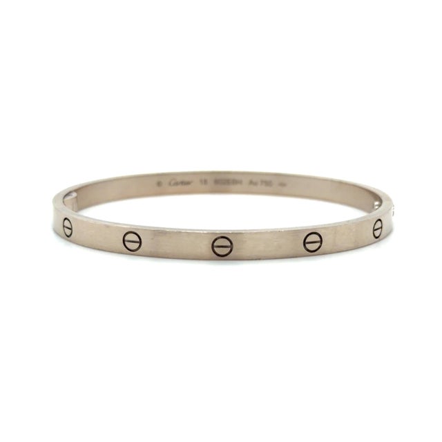 This classic bracelet by Cartier is in the Medium model from their iconic LOVE Collection. Mounted in 18 karat white gold...
