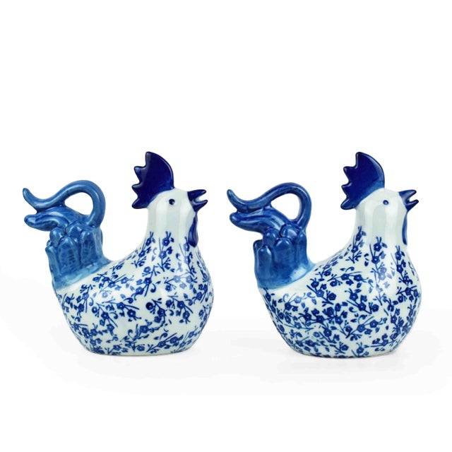 This charming pair of porcelain rooster figurines brings a classic Chinoiserie aesthetic to any tabletop or shelf. A...