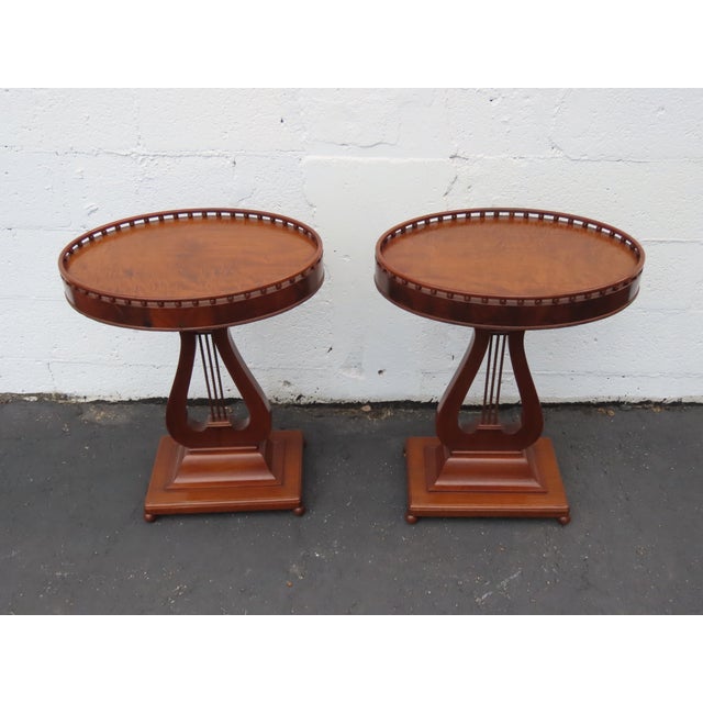 This beautiful Pair of Side Tables is made of wood, mahogany, and veneer. These two gorgeous end tables were made in the...