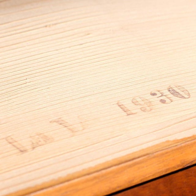 A pair of art deco walnut bedside cabinets with straight grain walnut veneer to sides, figured walnut tops and burr walnut...