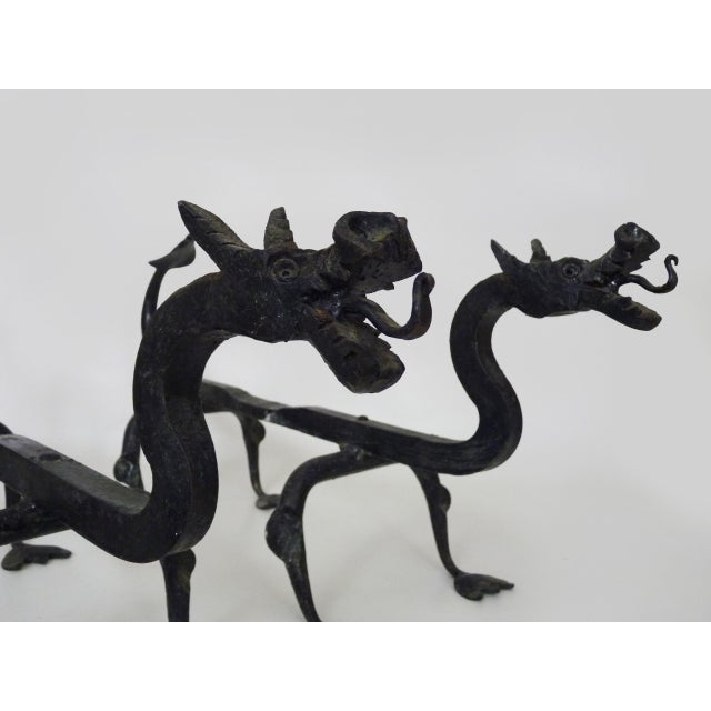 Pair of wrought iron dragon andirons These andirons are rare and made to be placed in your fireplace. This decorative pair...