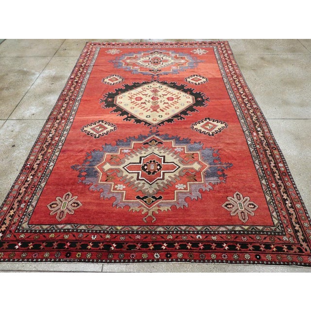 A vintage Turkish Anatolian room size carpet handmade during the mid-20th century. Measures: 8' 5" x 13' 0".