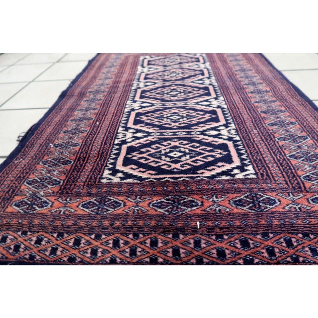 Handmade Vintage 1960s Uzbek Bukhara Rug – Small Wool Tribal Carpet (2.5' x 3.7') Bring a touch of history and...