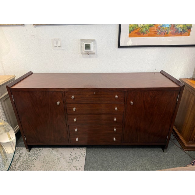 Design Plus Gallery presents a Dark Walnut Sideboard from Henredon. A magnificent piece for your dining area or kitchen...