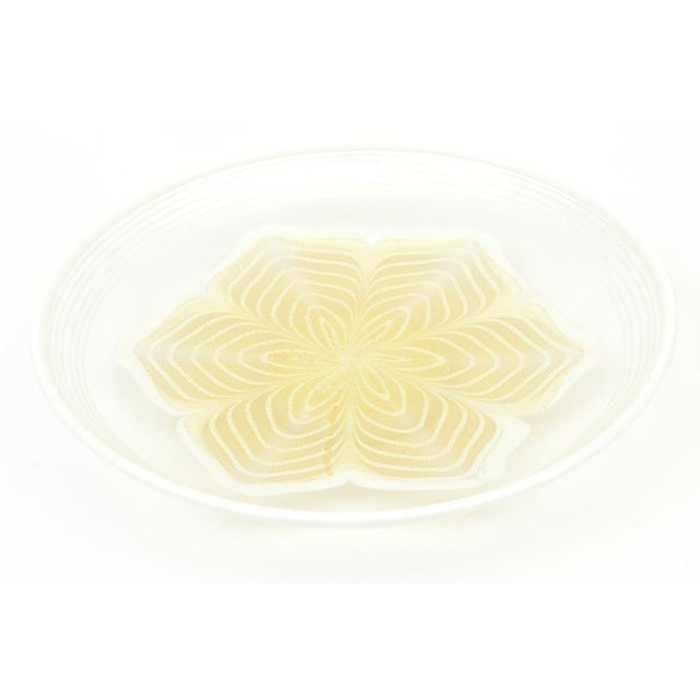 This beautiful Italian Murano bowl has a gorgeous flower design in the center. It is white with gold aventurine. It has a...