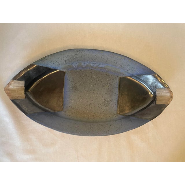 This hand made pottery platter is traditional in the sense of organic modern, southwestern or an Aztec styles. The varied...