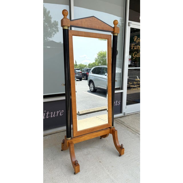 This Thomasville Grand Classics Cheval Mirror features a neoclassical design with contrasting black columns, a pediment...