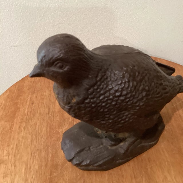This vintage heavy rusted cast iron quail sculpture is a handmade decorative collectible. The brown sculpture features a...