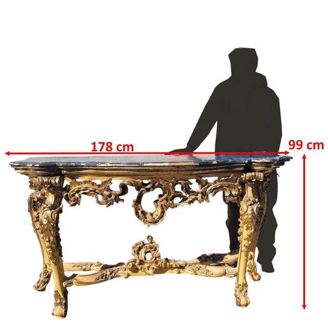 Large Louis XV console table in lacquered and gilded wood, with a faux-marble painted top and an ornate stretcher. Mecca...