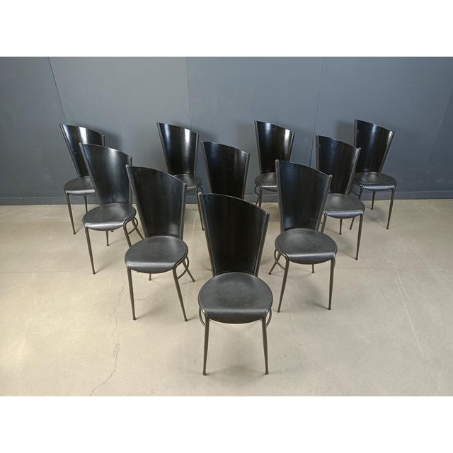 Vintage design dining chairs with black metal frames and black wooden backrests. Assymetric design wich makes them unique....