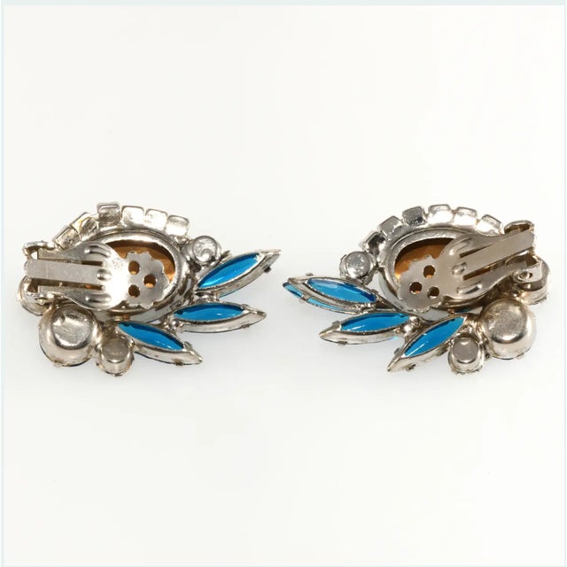 Juliana (made by DeLizza & Elster) clip earrings embellished with heliotrope oval stones surrounded by Bermuda blue, light...