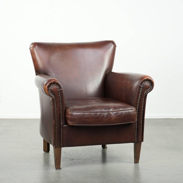 This comfortable sheepskin armchair has a rugged and characterful appearance with a touch of elegance, and features...