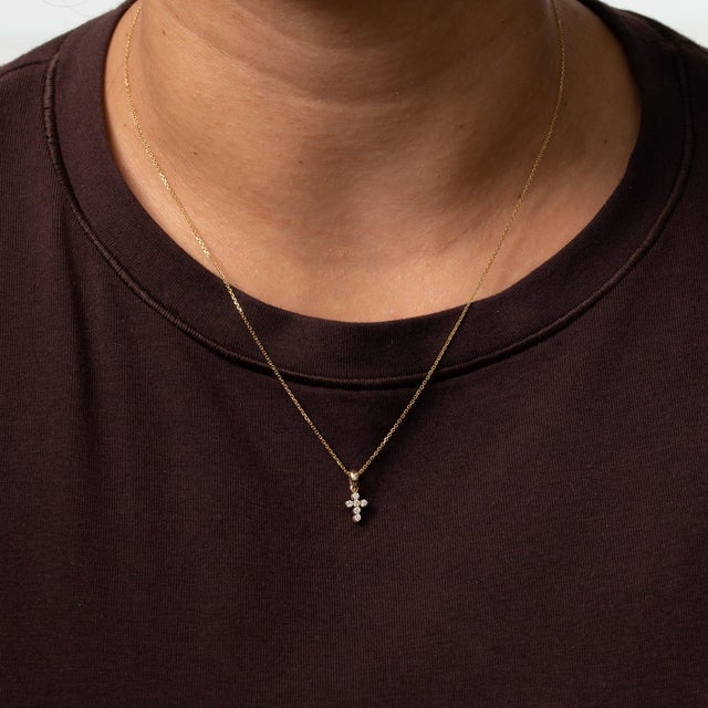 A 14K yellow gold pendant set with six lab grown diamonds totalling 0.13cttw. Lab grown diamonds share the fire and...