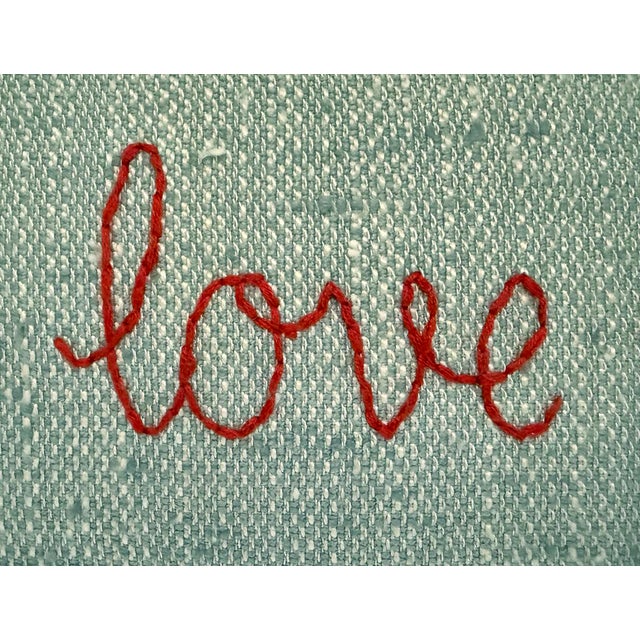 Custom made hand embroidered pillow. Woven "seafoam" linen front with deep orange script "make love not war" embroidery....