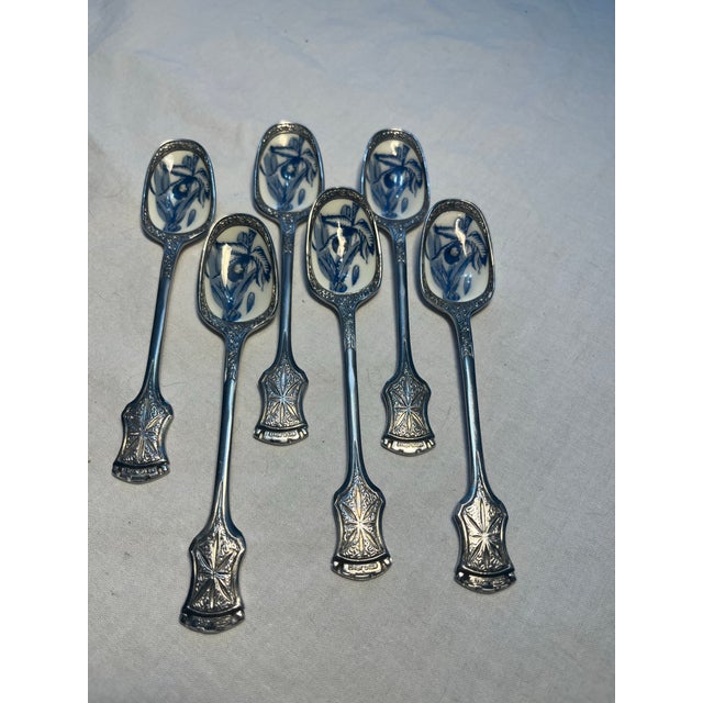 Vintage 6 dessert spoins . Silver plate with cloisonne blue & white enamal fruit design in the bowl . Handles embossed...