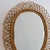 Rattan wall mirror (circa 1960s) in that inimitable italian style that is so loved. This mirror has a complex weave of...