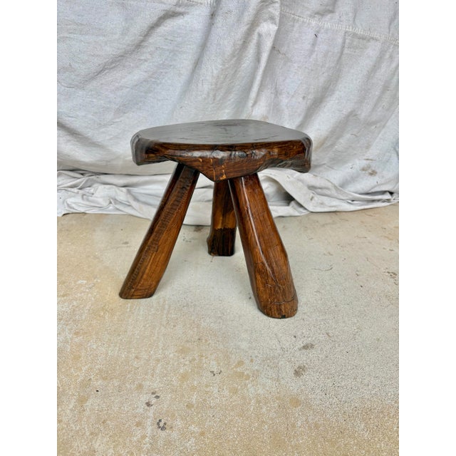 Found in the South of France, this Mid 20th Century Tripod Stool was crafted by artisans from walnut in the French...