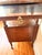 Beautiful vintage solid wood Empire-style washstand featuring two spacious drawers, an open lower shelf, elegant turned...