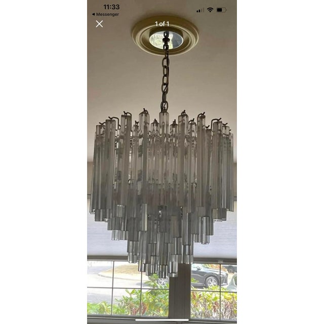 Beautiful vintage mid century modern chandelier. Late 1970s era light. Chrome silver skeleton with lots of lights....