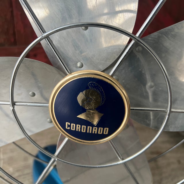 This vintage Coronado fan showcases timeless design with a sturdy blue-metal base and aluminum blades. Oscillation does...