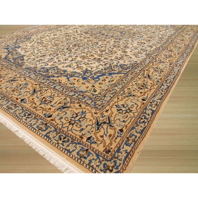 This hand knotted pile rug is a Sarouk style piece crafted from a premium blend of wool and silk. Originating from India,...