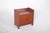 Teak bar cabinet. With a compact and functional design, the cabinet has a rectangular structure with rounded sides and a...