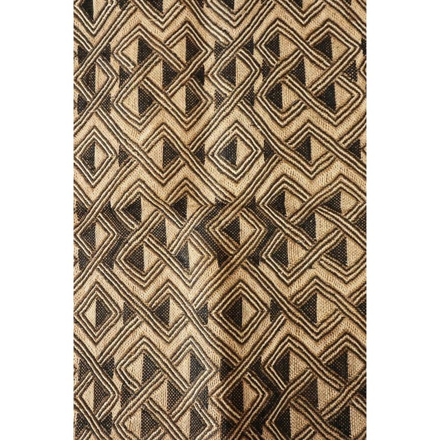 Showa cloth from the Democratic Republic of Congo are made from raffia cut-pile cloths, woven by Kuba men & embroidered by...