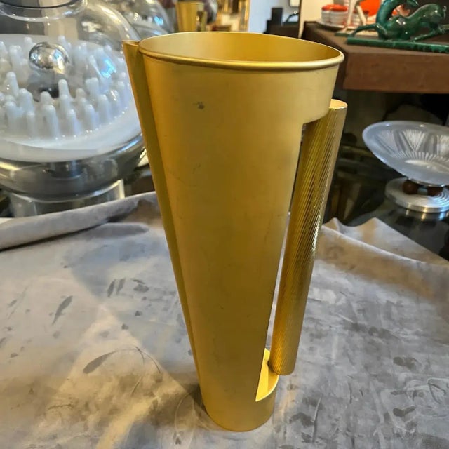 Striking 1970s Modern Gilded Metal Sculptural Italian Design Jug Vase Presenting a remarkable piece of 1970s Italian...