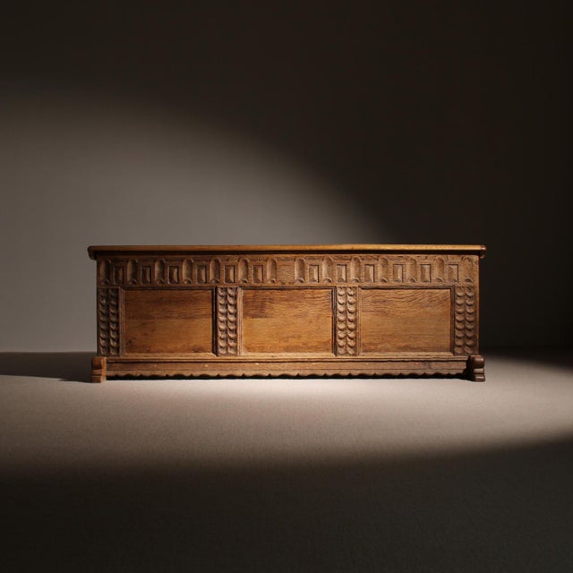 Description for sale is a handcrafted solid oak chest from a rural background featuring characterful wood carvings and a...