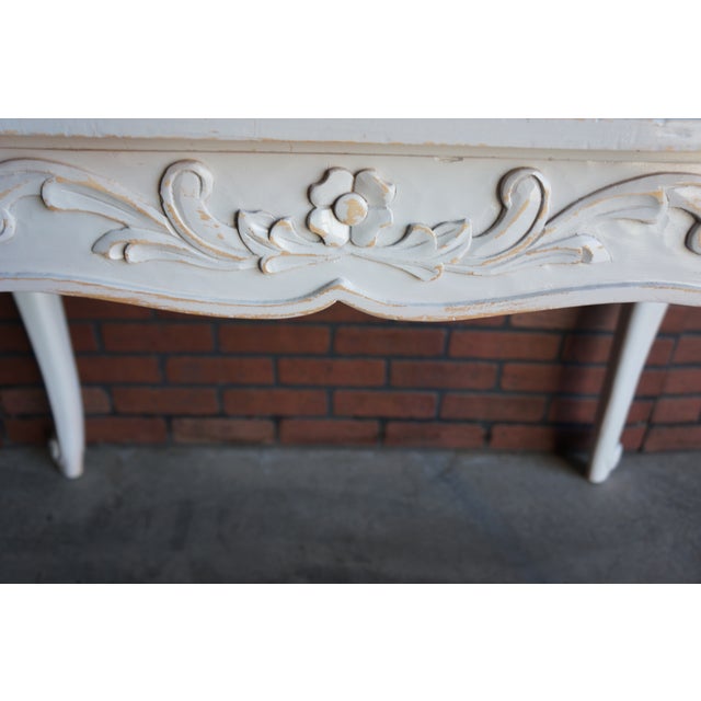 French style writing desk. Crafted of pine with sweet carved details. Custom painted in our Monet Blue, a soft grayed blue...