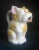 This small dog pitcher could also be used as a creamer. no defects. Japan stamped on bottom indicating that piece was made...