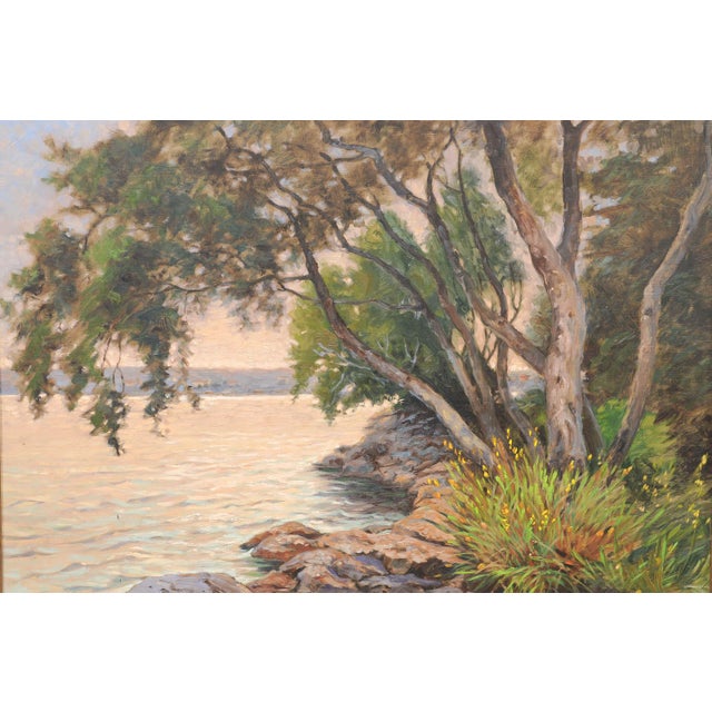 Swedish landscape oil painting in an impressionistic manner, capturing a peaceful rocky shoreline, and likely dating from...