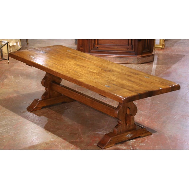 This impressive antique refectory table was crafted in France circa 1890. Built from solid walnut wood, the substantial...