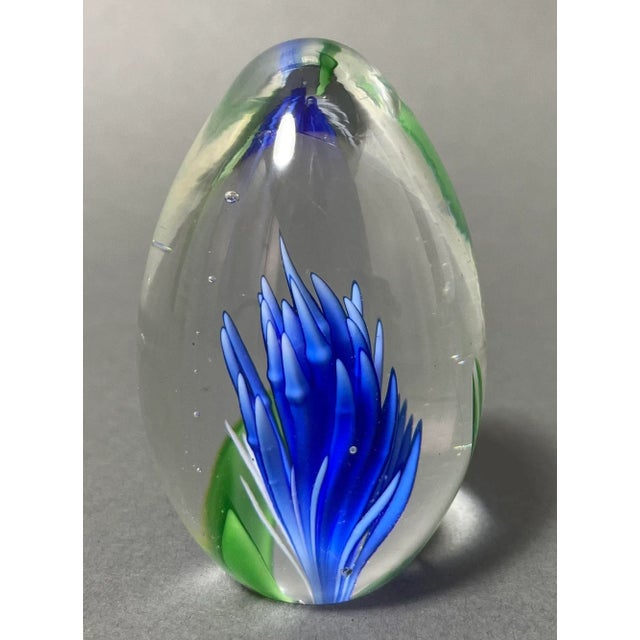 Vintage Italian blown art glass paperweight in vibrant blue and green in a transparent egg shape. Vintage Italian Murano...