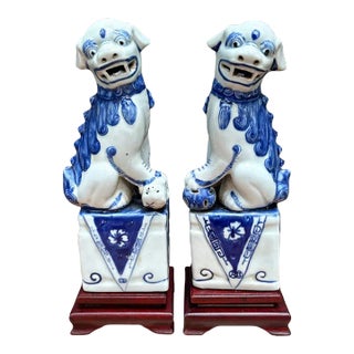 Antique Chinese Blue/White Ceramic Foo Dogs on Wood Stands For Sale