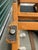 Orange Pair of 1970s Billy Baldwin Style X-Base Ottomans in Original Orange Herringbone Upholstery For Sale - Image 8 of 9
