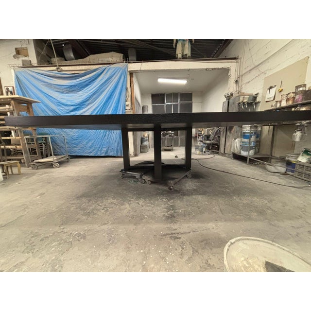 Modern square dining table . Table . Solid and made of alder with oak veneer Table has an ebony finish. We refinished this...