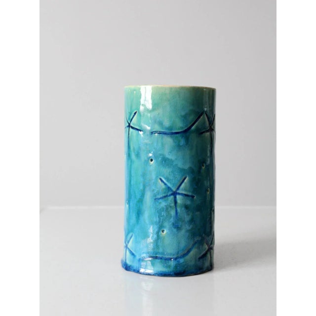 Striking signed vintage studio pottery vase, hand-crafted in a tall, sculptural form and adorned with distinctive starfish...
