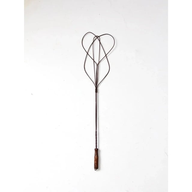 An antique rug beater with classic early American character. This carpet beater features a distinctive honeycomb twisted...