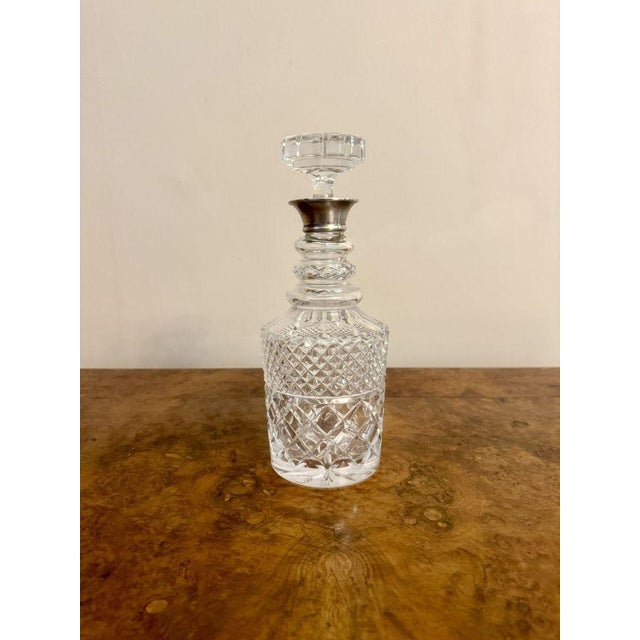 Quality antique Edwardian silver collar cut glass decanter having a quality antique Edwardian silver hallmarked collar...