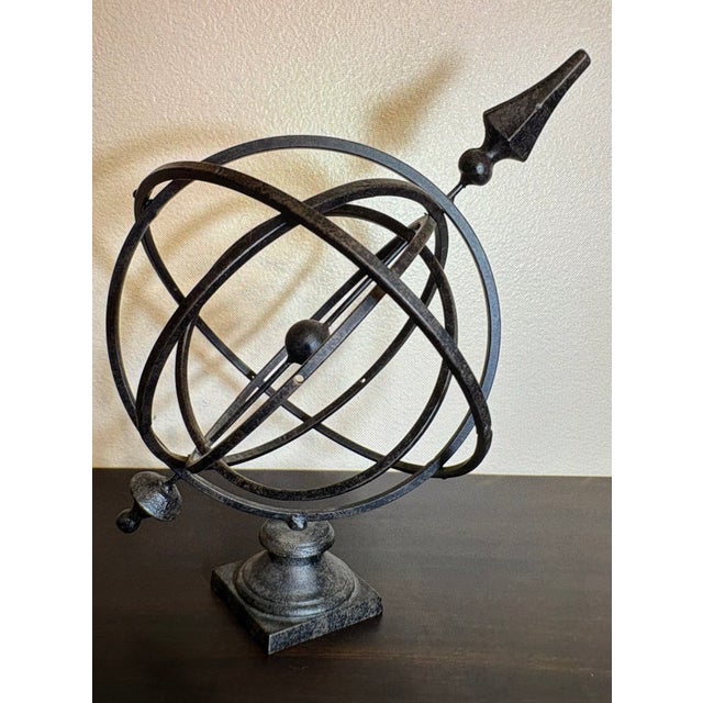 A astrological armillary sphere used to guide astronomers to map the cosmos many years ago with it's changing patterns;...