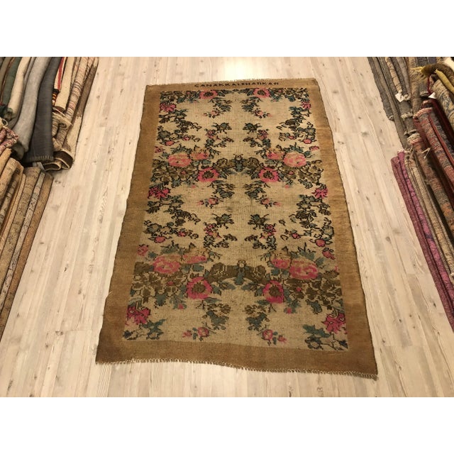 This is a vintage Turkish Oushak rug from the 1960s. The piece was hand-knotted.
