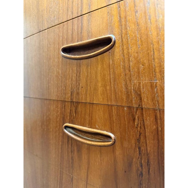 This is a beautiful, high-quality Danish teak chest from the 1960s. It features a stylish curved front, clean edges, and...