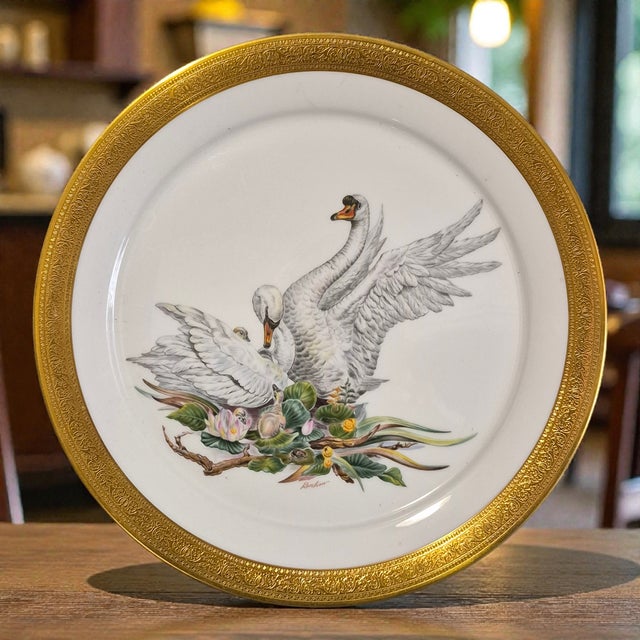 The Vintage 1972 Edward Marshall Boehm Birds of Peace Swan Gilded Platter is a decorative collectible featuring a round...