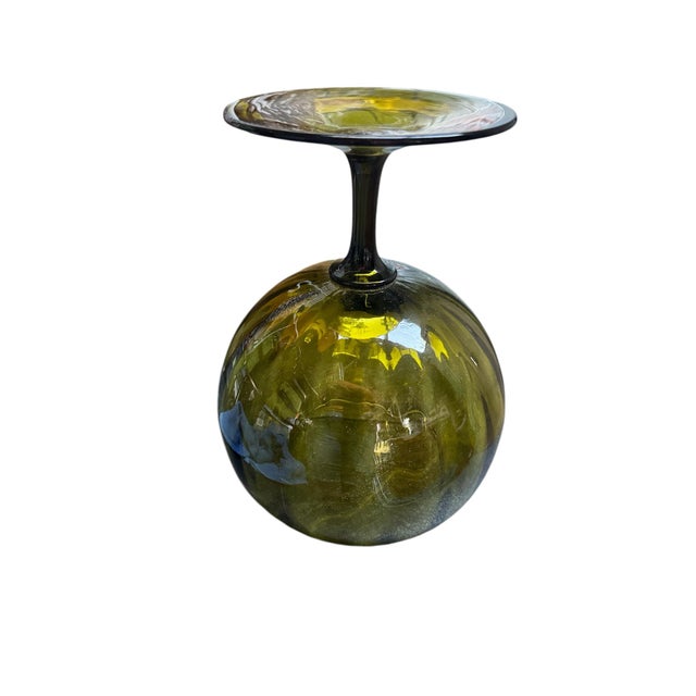 Italian art glass footed bowl or vase produced in Empoli, a region known for its mid-century glassmaking. The distinctive...