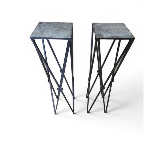 Elegant pair of wrought iron pedestals crafted during the 1950s, inspired by the architectural forms and proportions of...