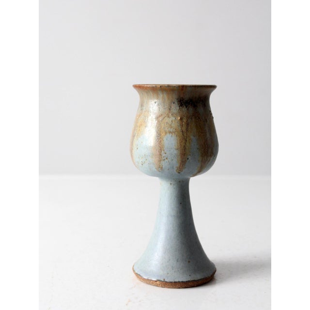 This is a vintage studio pottery chalice. The handmade pottery glass sky blue and fawn brown glaze.