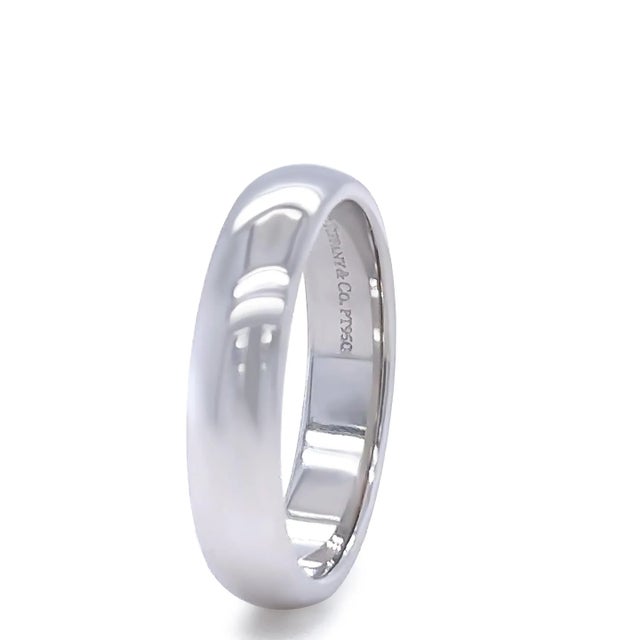 This elegant Tiffany & Co. Forever wedding band is crafted in luxurious platinum with a comfort fit design, offering...
