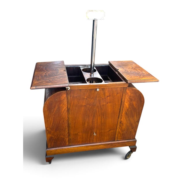 Art Deco Walnut Asprey "Elevette" Patent Mechanical Drinks Cabinet, circa 1930s. An exceptional and highly sought-after...