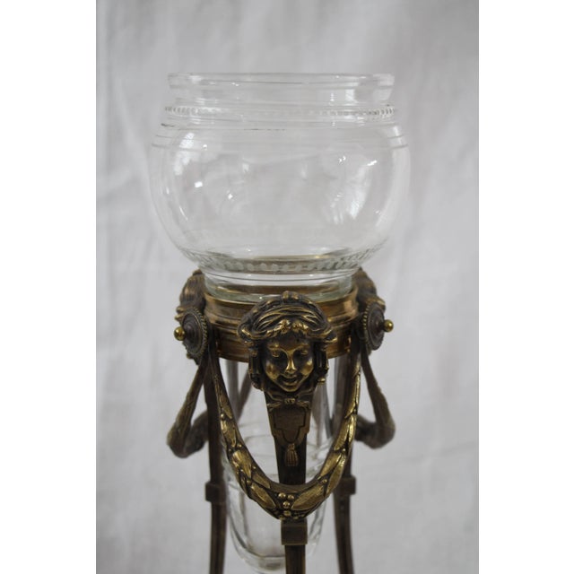 Introducing a stunning pair of glass vases with exquisitely decorated bronze stands, evoking the timeless elegance of the...